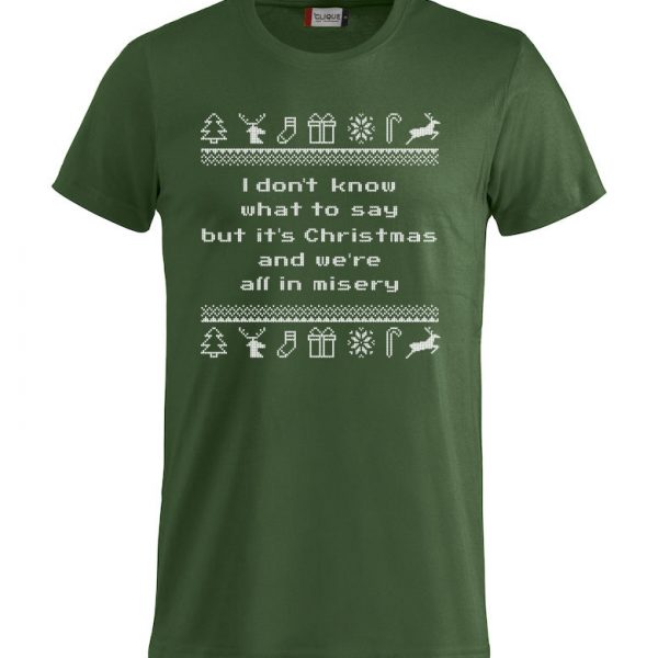 Grønn t-skjorte med sitat fra "Hjelp, det er juleferie", "I don´t know what to say, but it´s Christmas and we´re all in misery"
